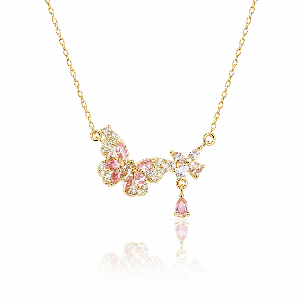 Gold butterfly necklace with pink crystals and floral charm